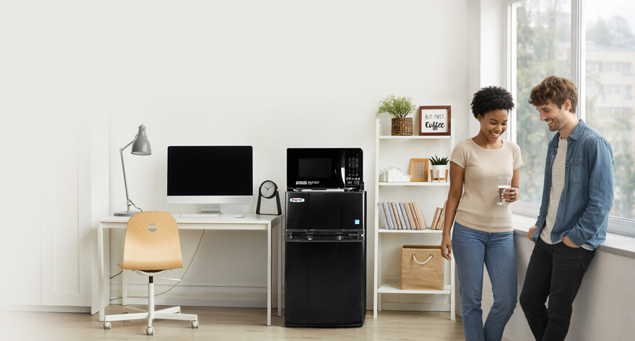 Couple enjoying coffee near appliances - MicroFridge by Danby